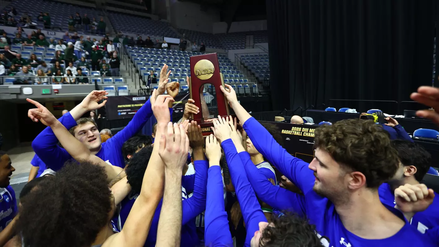 The CNU's Men's Basketball team celebrating post-game.